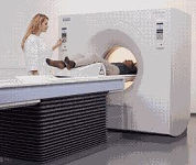 A
technologist positions a patient for a CT scan